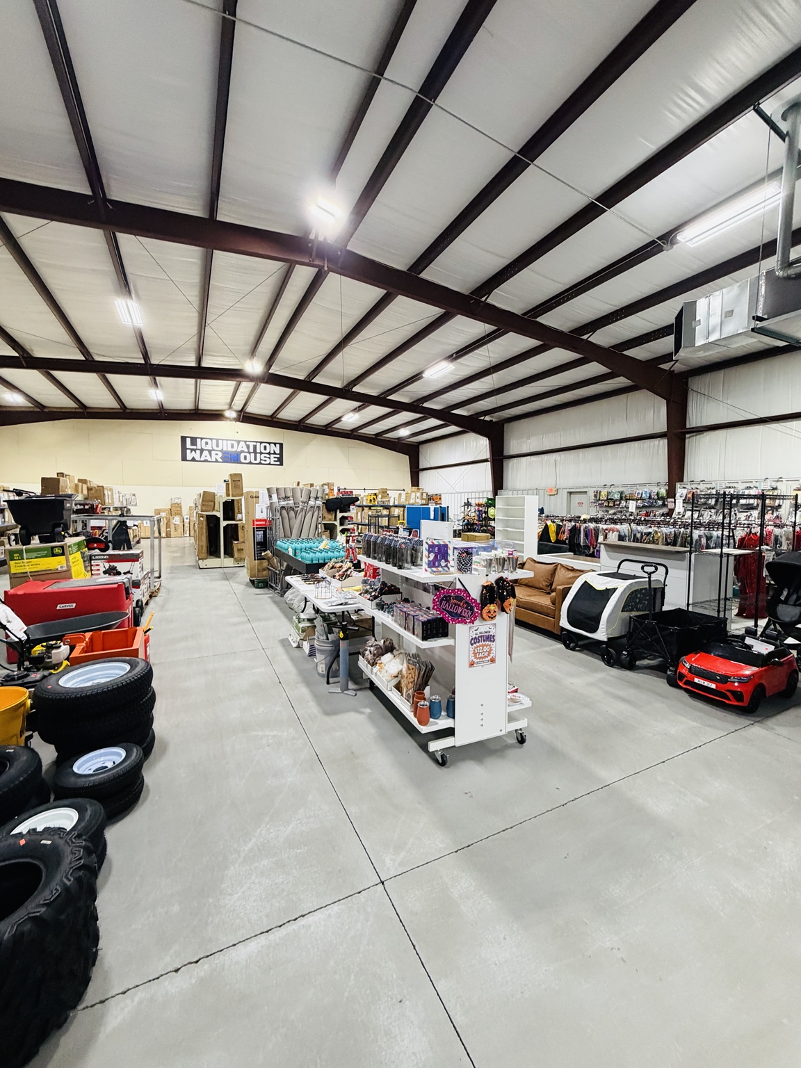 Inside Elevate Home Improvement with changing truckload merchandise on display