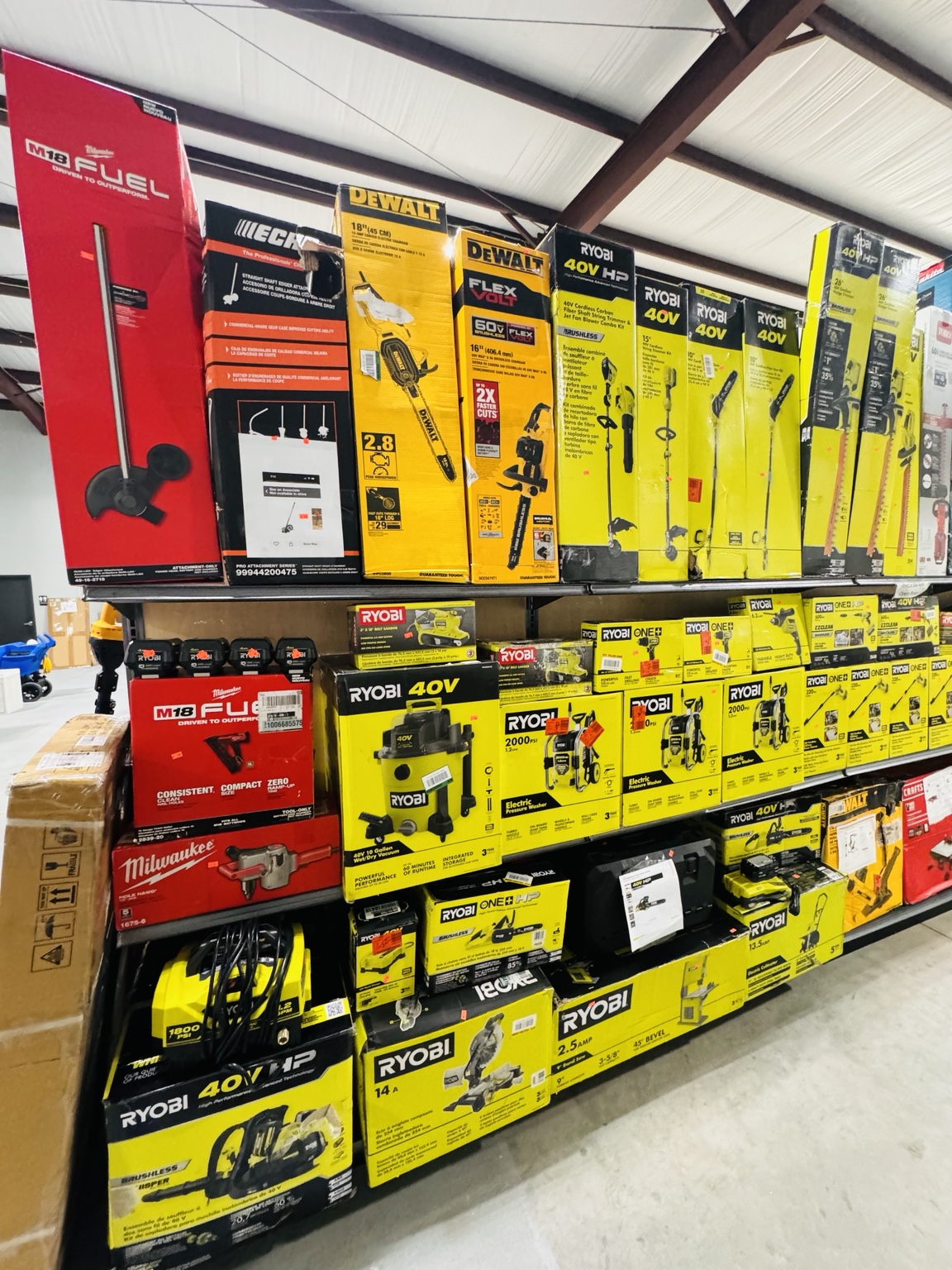 Shelves stocked with power tools and outdoor equipment